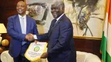 football le premier ministre beugre mambe reconnaissant a la caf pour le awards 2023 remis au president alassane ouattara